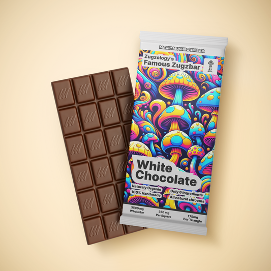 The image displays Zugzologys 3500mg Homemade White Chocolate Zugzbar, with vibrant psychedelic mushroom illustrations in blue, orange, and yellow hues on the colorful packaging. Its labeled to emphasize its organic ingredients and mushroom content, inviting you on an euphoric journey.